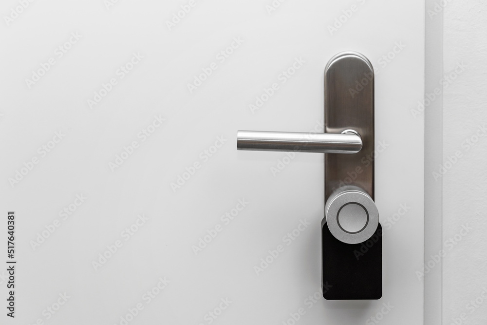 Electronic door handle installed on wood door. Door with digital door lock systems best security
