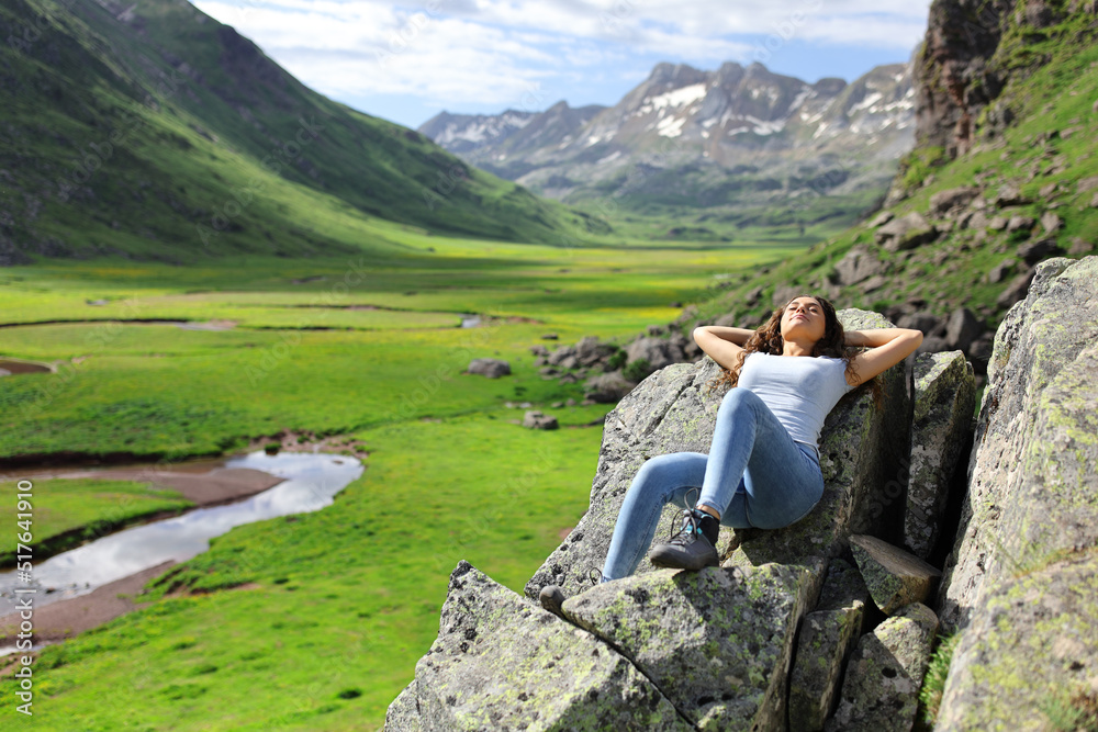 Woman resting in a mountain landscape