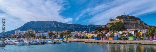 Denia Spain panoramic view castle Alicante with colourful houses and mountain and beautiful blue sky photo