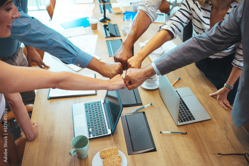 © Dragana Gordic - Happy motivated young and older generation multiracial business people joining fists, showing support and team spirit together, celebrating corporate achievement or success at meeting in office. © Dragana Gordic - Happy motivated young and older generation multiracial business people joining fists, showing support and team spirit together, celebrating corporate achievement or success at meeting in office.
