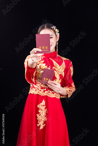 A woman in a red Traditional Chinese wedding dress