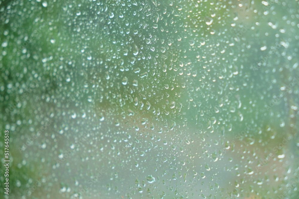 Raindrops on the glass of window Closeup