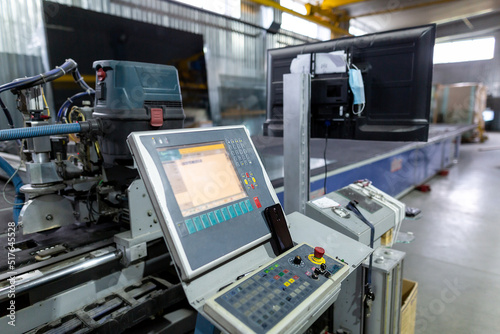 Factory for the production of double-glazed windows made of sheet glass. Sheet glass in pallets near the sheet glass cutting line.