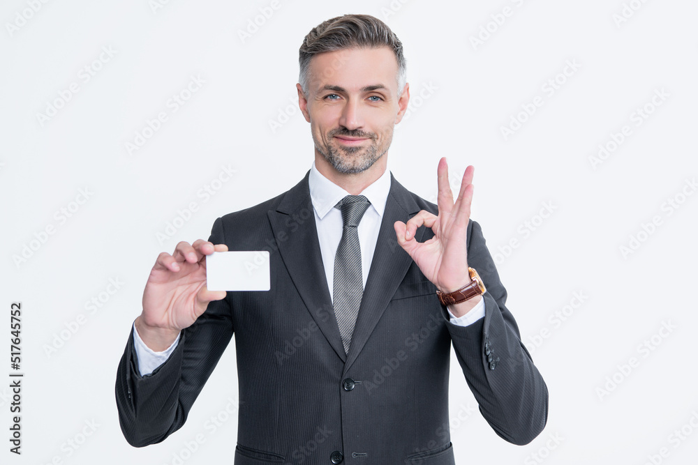 businessman in suit hold business card isolated on white background. ok businessman in suit hold business card isolated on white background. ok