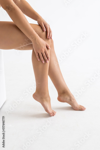 Female legs. shot in studio. Beautiful smooth and shaved legs isolated on white background