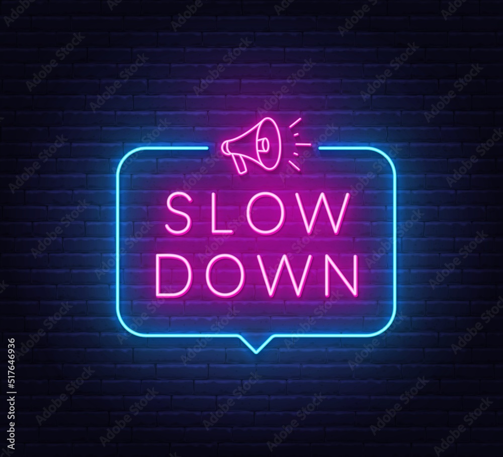 Slow Down neon sign in the speech bubble on brick wall background. - obrazy, fototapety, plakaty 