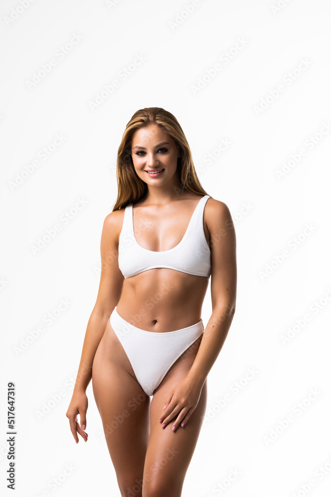 Beautiful fitness woman with a perfect body isolated on white background Beautiful fitness woman with a perfect body isolated on white background