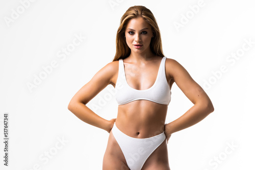 Sexy young girl in white lingerie on a white background. close up
