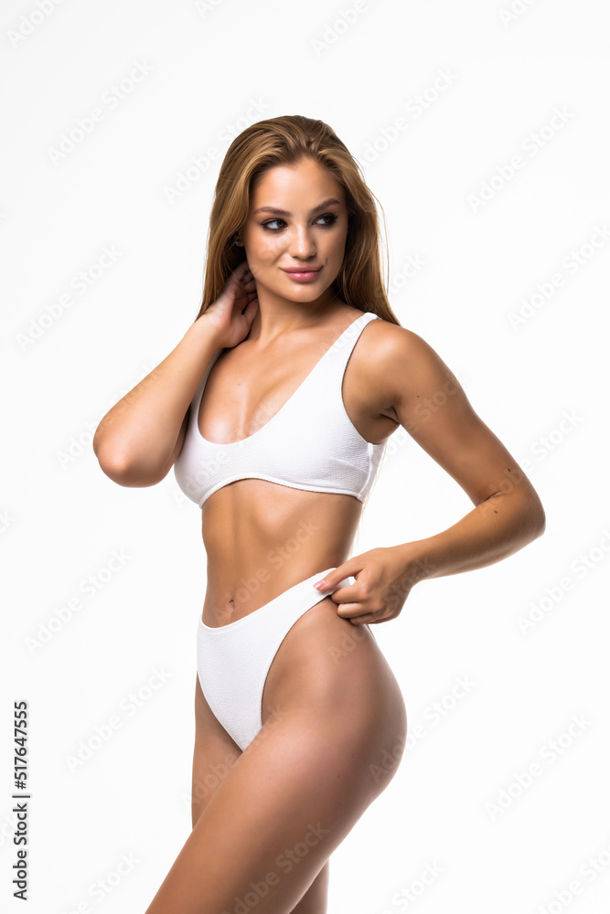 Young woman with perfect body in underwear standing on white background Young woman with perfect body in underwear standing on white background