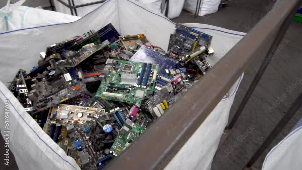Steady medium moving shot of electronic parts ready for recycling