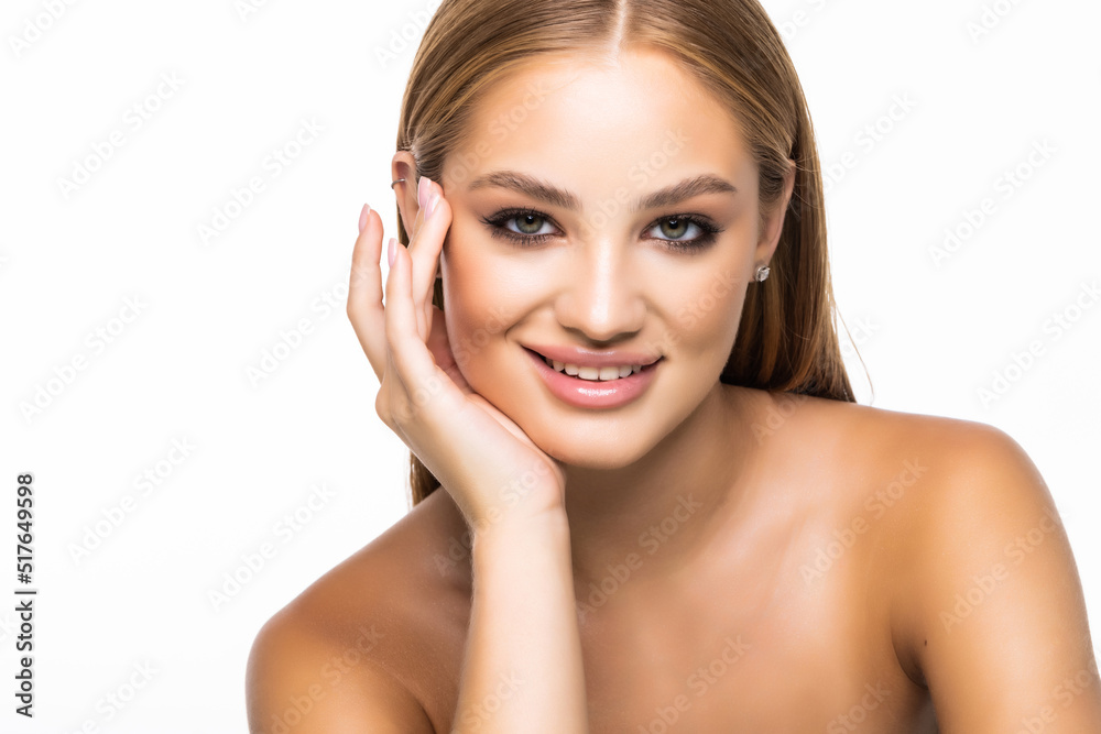 Beauty portrait of a smiling woman looking at camera isolated on a white background Beauty portrait of a smiling woman looking at camera isolated on a white background