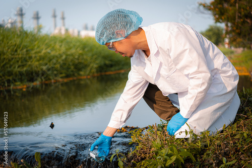 Scientists team collect water samples for analysis and research on water quality, environment with saving earth.