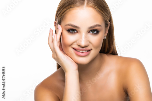 Beauty portrait of a smiling woman looking at camera isolated on a white background