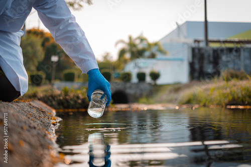Scientists team collect water samples for analysis and research on water quality, environment with saving earth.