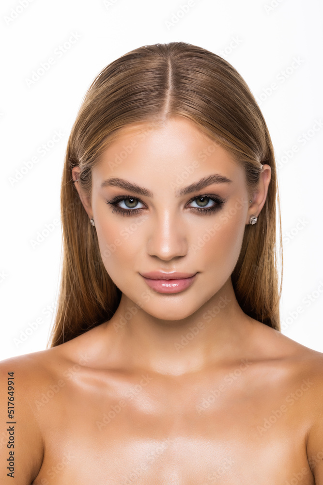 Young woman touching her face isolated on white background. Skincare. Young woman touching her face isolated on white background. Skincare.