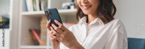 Woman holding a smartphone and using online social on lifestyle. Technology for communication concept.