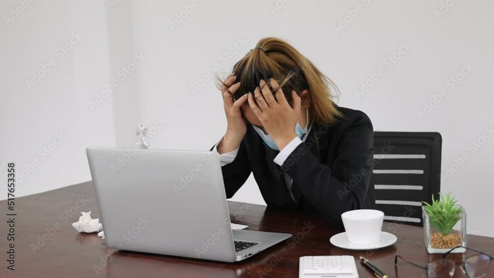 stressed girl Feeling headaches due to computer overwork or sedentary lifestyle Employees who are tired of working in the office, Office Syndrome. stressed girl Feeling headaches due to computer overwork or sedentary lifestyle Employees who are tired of working in the office, Office Syndrome.