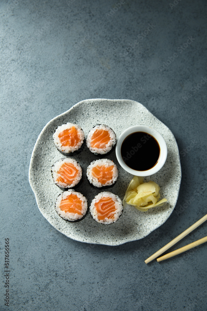 Homemade salmon maki rolls with soy sauce Homemade salmon maki rolls with soy sauce
