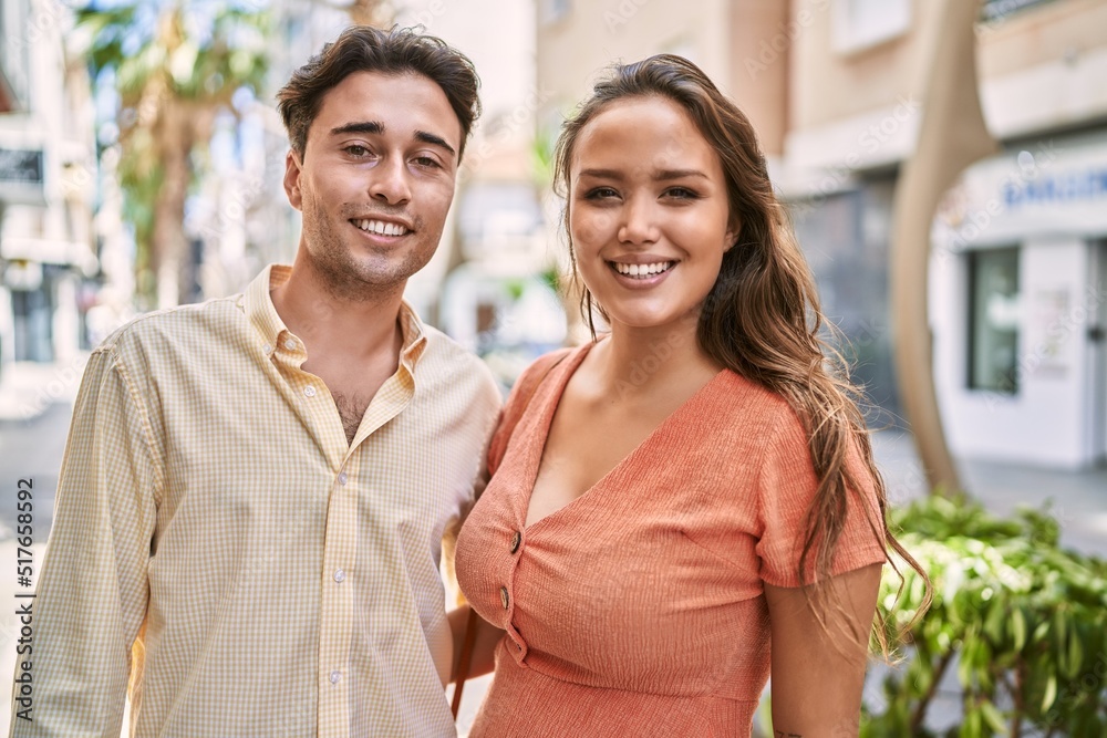 Man and woman couple smiling confident and hugging each other at street Man and woman couple smiling confident and hugging each other at street