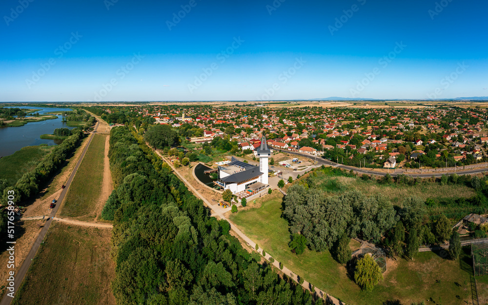 Turistical eco center of lake Tisza in Poroszlo city Hungary.  Hight quality aerial view with Poroszlo cityscape. The visitors can get to know Tisza lake's wildlife. Hungarian name is Tisza to