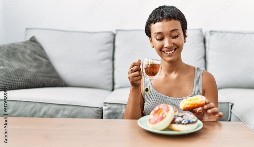 Young hispanic woman smiling confident having breakfast at home Young hispanic woman smiling confident having breakfast at home