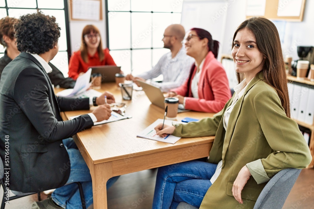 Group of business workers smiling happy working at the office.