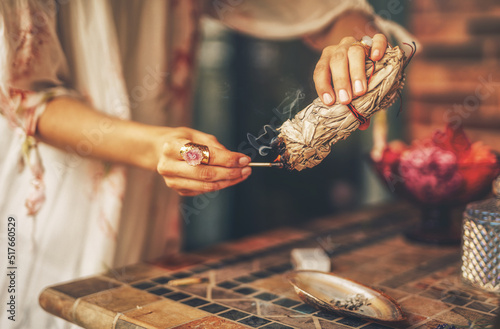 incense in a woman hand, ceremony space. photo