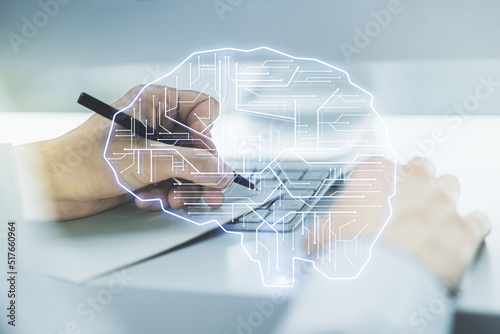 Double exposure of creative human brain microcircuit with hand writing in notepad on background with laptop. Future technology and AI concept