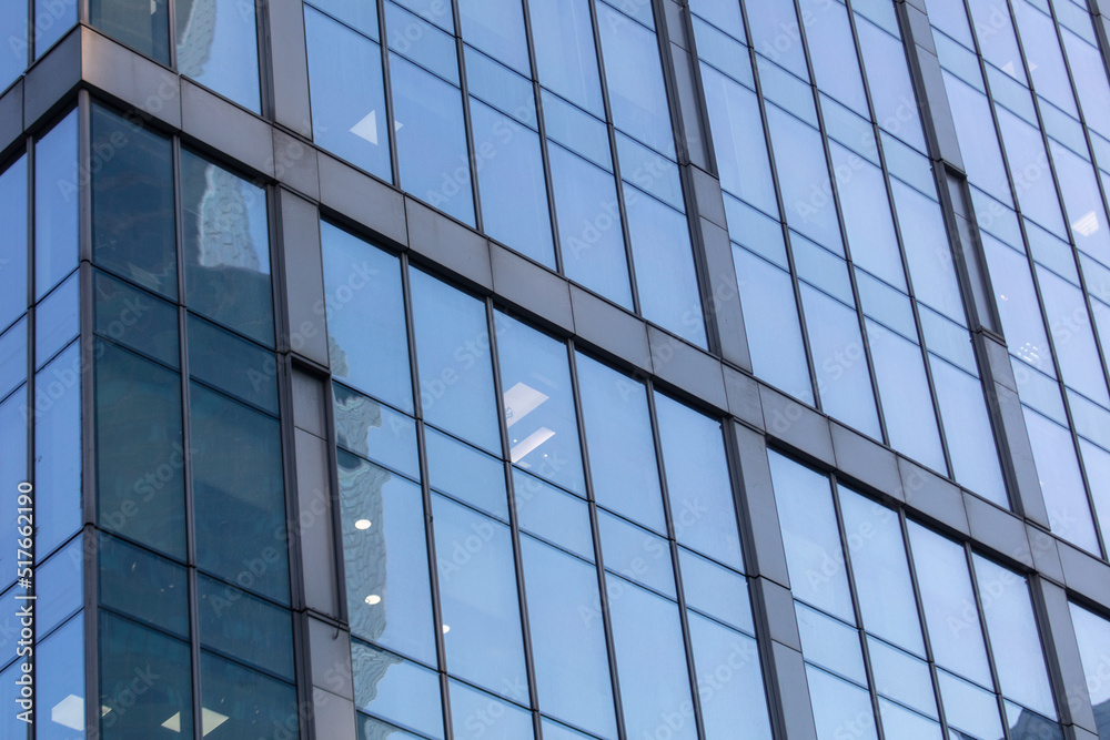 Glass walls of a skyscraper as a background.