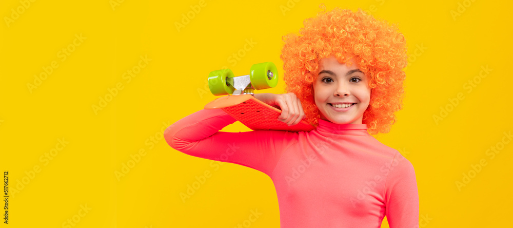 Happy girl child with orange hair in pink poloneck smile holding penny board, pennyboard. Funny teenager child on party, poster banner header with copy space. Happy girl child with orange hair in pink poloneck smile holding penny board, pennyboard. Funny teenager child on party, poster banner header with copy space.
