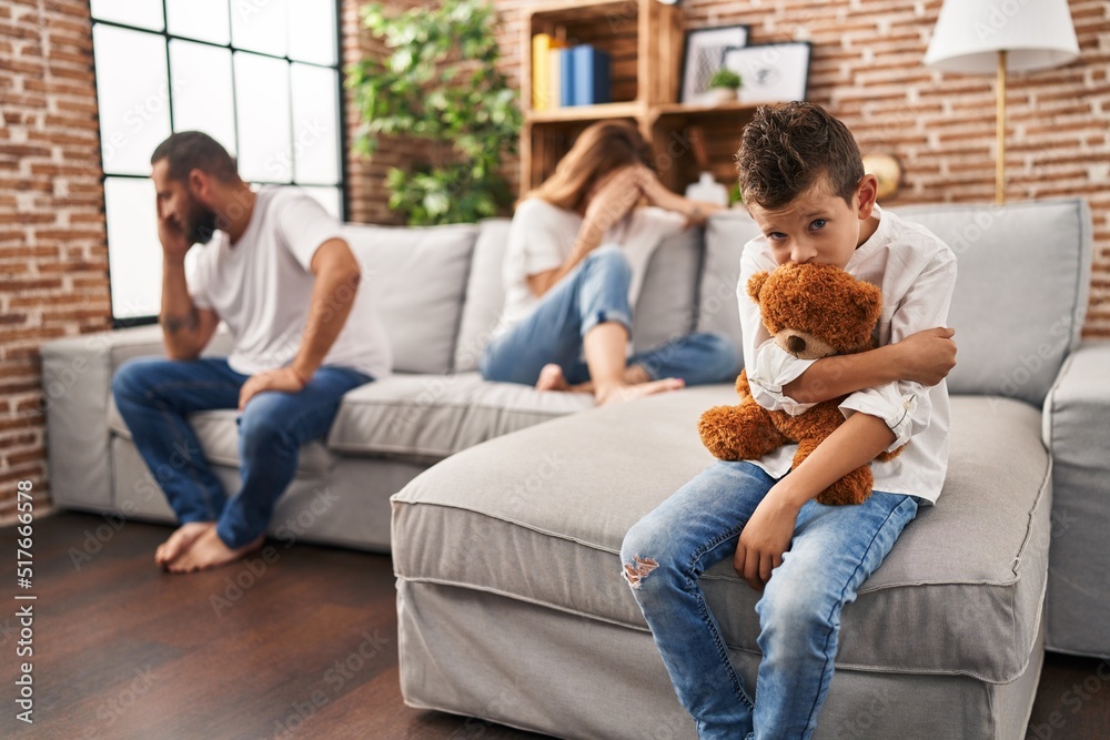 Family sitting on sofa and kid sad for partents argue at home Family sitting on sofa and kid sad for partents argue at home