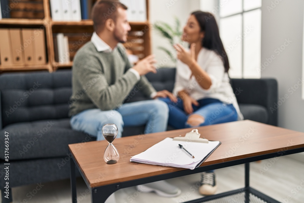 Man and woman arguing having couple therapy session at psychology clinic Man and woman arguing having couple therapy session at psychology clinic