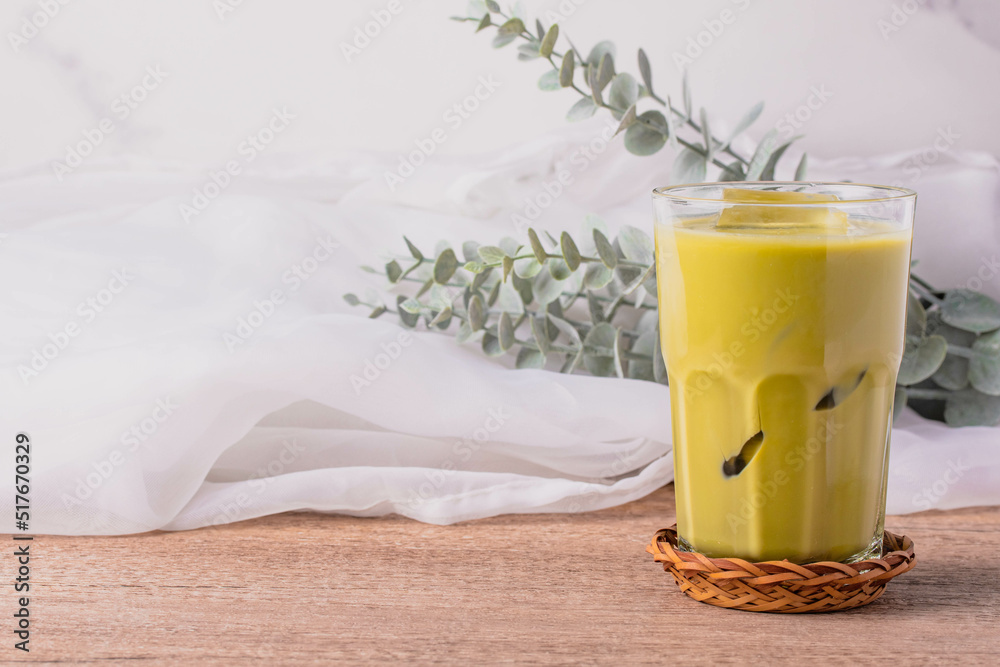 Iced matcha green tea drink in a clear glass Iced matcha green tea drink in a clear glass
