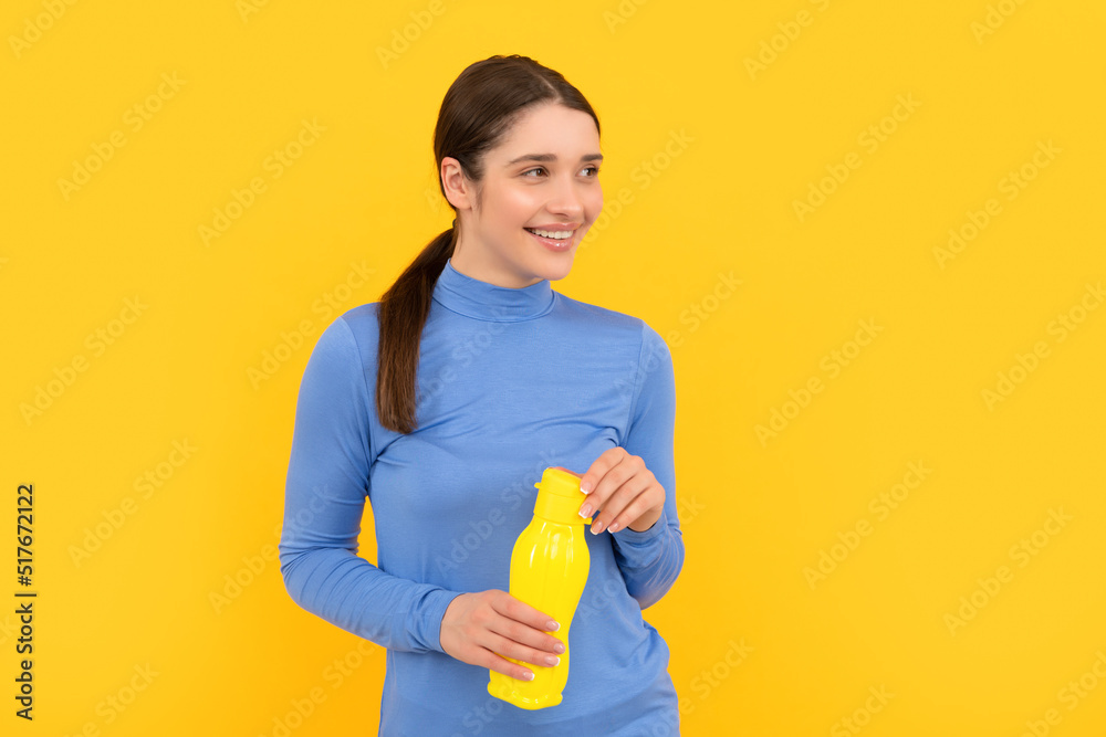 happy woman hold mineral water. feel thirsty. young girl with sport plastic bottle. happy woman hold mineral water. feel thirsty. young girl with sport plastic bottle.
