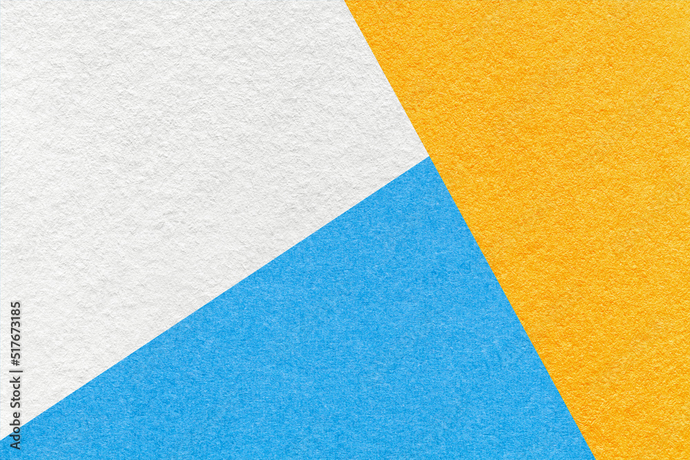 Texture of craft white, yellow and blue shade color paper background, macro. Structure of vintage abstract cardboard Texture of craft white, yellow and blue shade color paper background, macro. Structure of vintage abstract cardboard