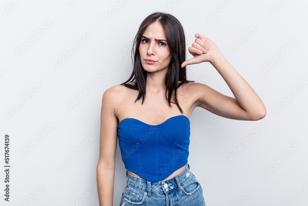 Young caucasian woman isolated on white background showing thumb down, disappointment concept.