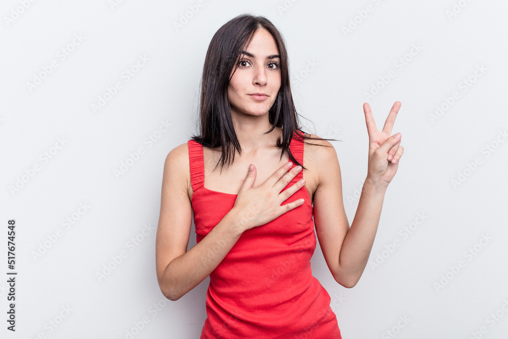 Young caucasian woman isolated on white background taking an oath, putting hand on chest. Young caucasian woman isolated on white background taking an oath, putting hand on chest.