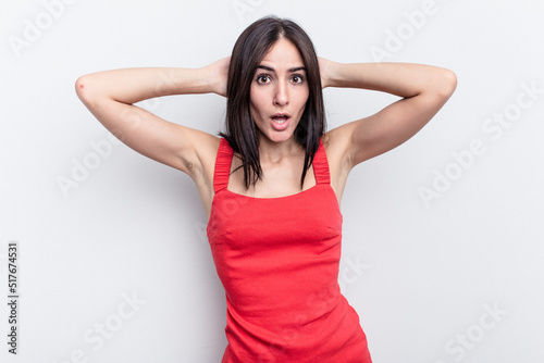 Young caucasian woman isolated on white background screaming, very excited, passionate, satisfied with something.