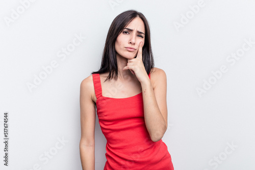 Young caucasian woman isolated on white background crying, unhappy with something, agony and confusion concept.