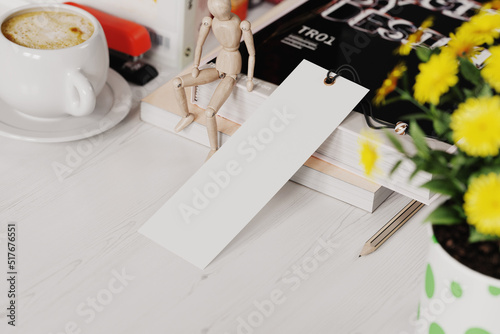 Paper bookmark at workplace mockup. 3D rendering photo