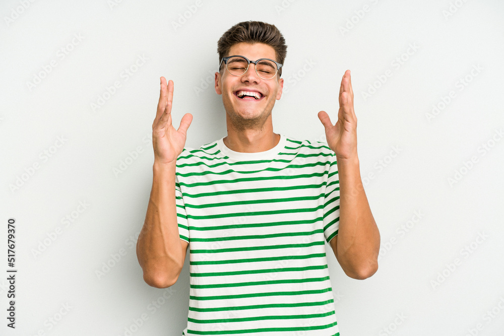 Young caucasian man isolated on white background joyful laughing a lot. Happiness concept. Young caucasian man isolated on white background joyful laughing a lot. Happiness concept.
