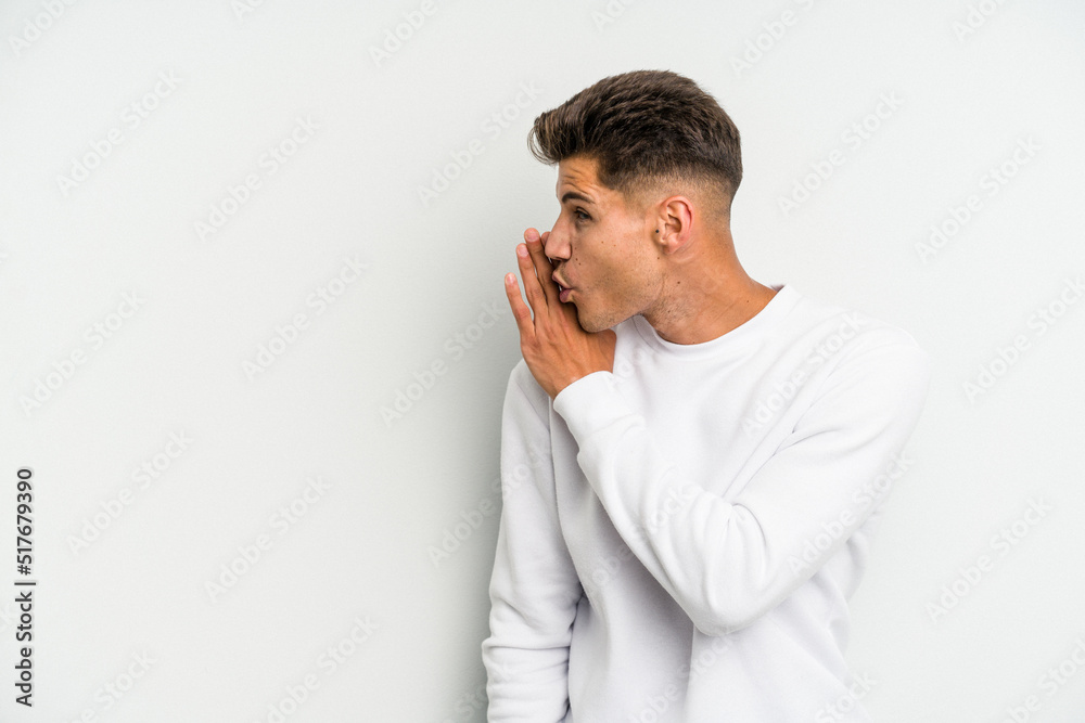 Young caucasian man isolated on white background being shocked because of something she has seen. Young caucasian man isolated on white background being shocked because of something she has seen.