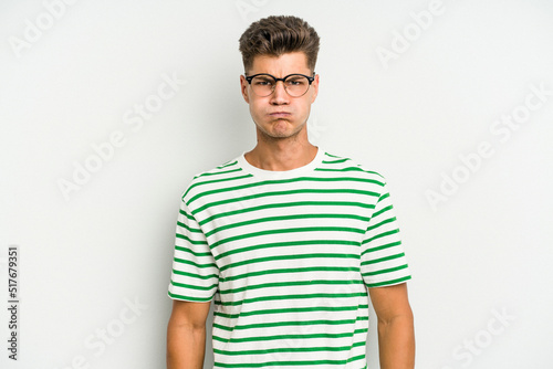 Wallpaper Mural Young caucasian man isolated on white background blows cheeks, has tired expression. Facial expression concept. Torontodigital.ca