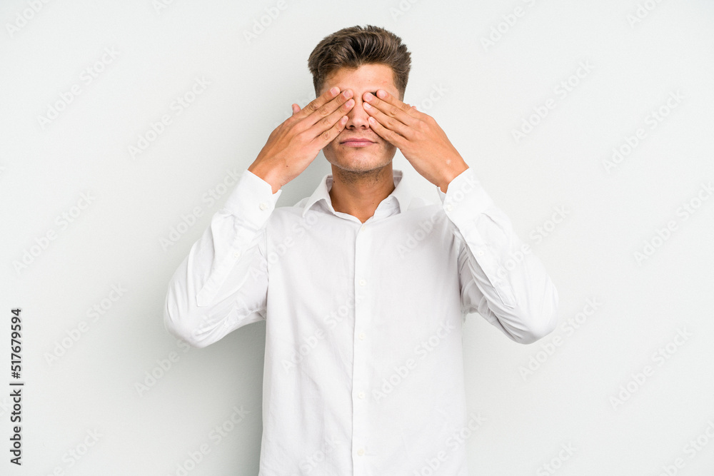 Young caucasian man isolated on white background afraid covering eyes with hands. Young caucasian man isolated on white background afraid covering eyes with hands.