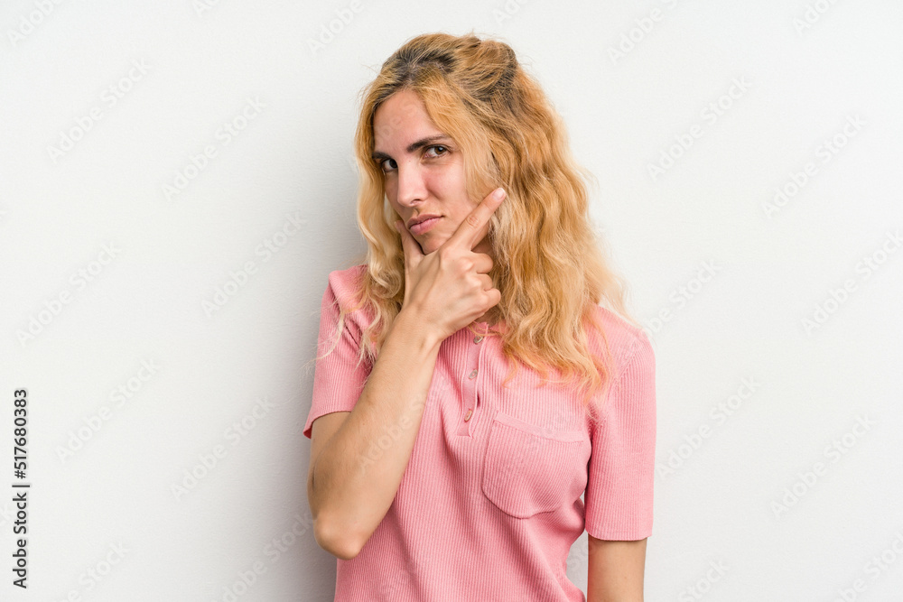 Young caucasian woman isolated on white background contemplating, planning a strategy, thinking about the way of a business. Young caucasian woman isolated on white background contemplating, planning a strategy, thinking about the way of a business.