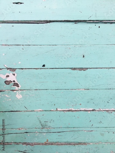 The old light blue wooden floor is worn out. There is an old plank-patterned wall that has been used for a long time. Gives a feeling of old and beautiful