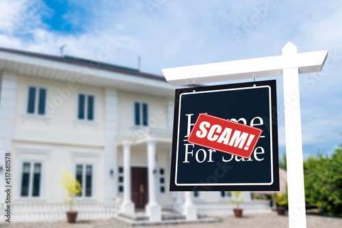 A fake house for sale sign outed as a fraud. Concept Fake home listings and rental scams. photo