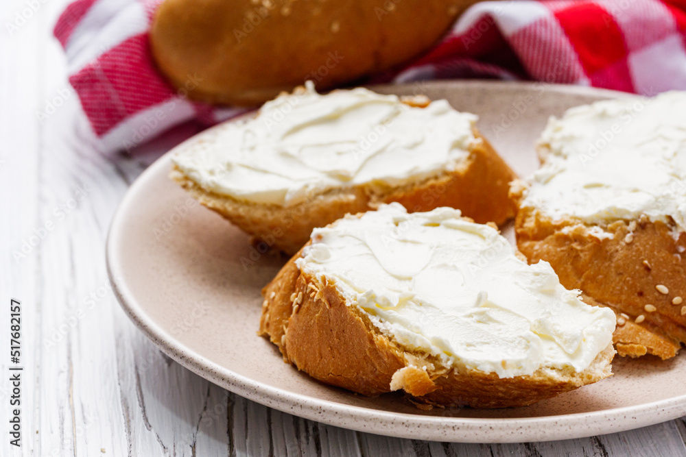 baguette cream cheese sandwich on a white background baguette cream cheese sandwich on a white background