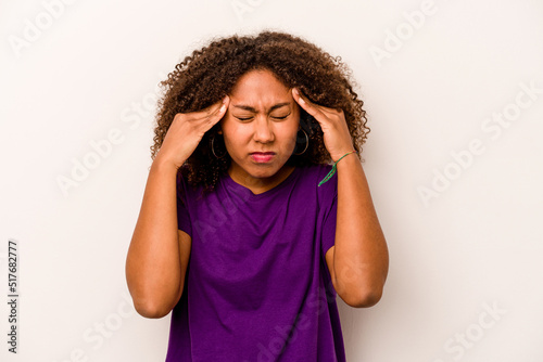 Young African American woman isolated on white background touching temples and having headache.