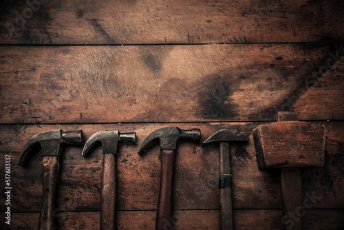 Obraz na plátně flat lay picture of rusty carpenter equipment hammers on top of workbench